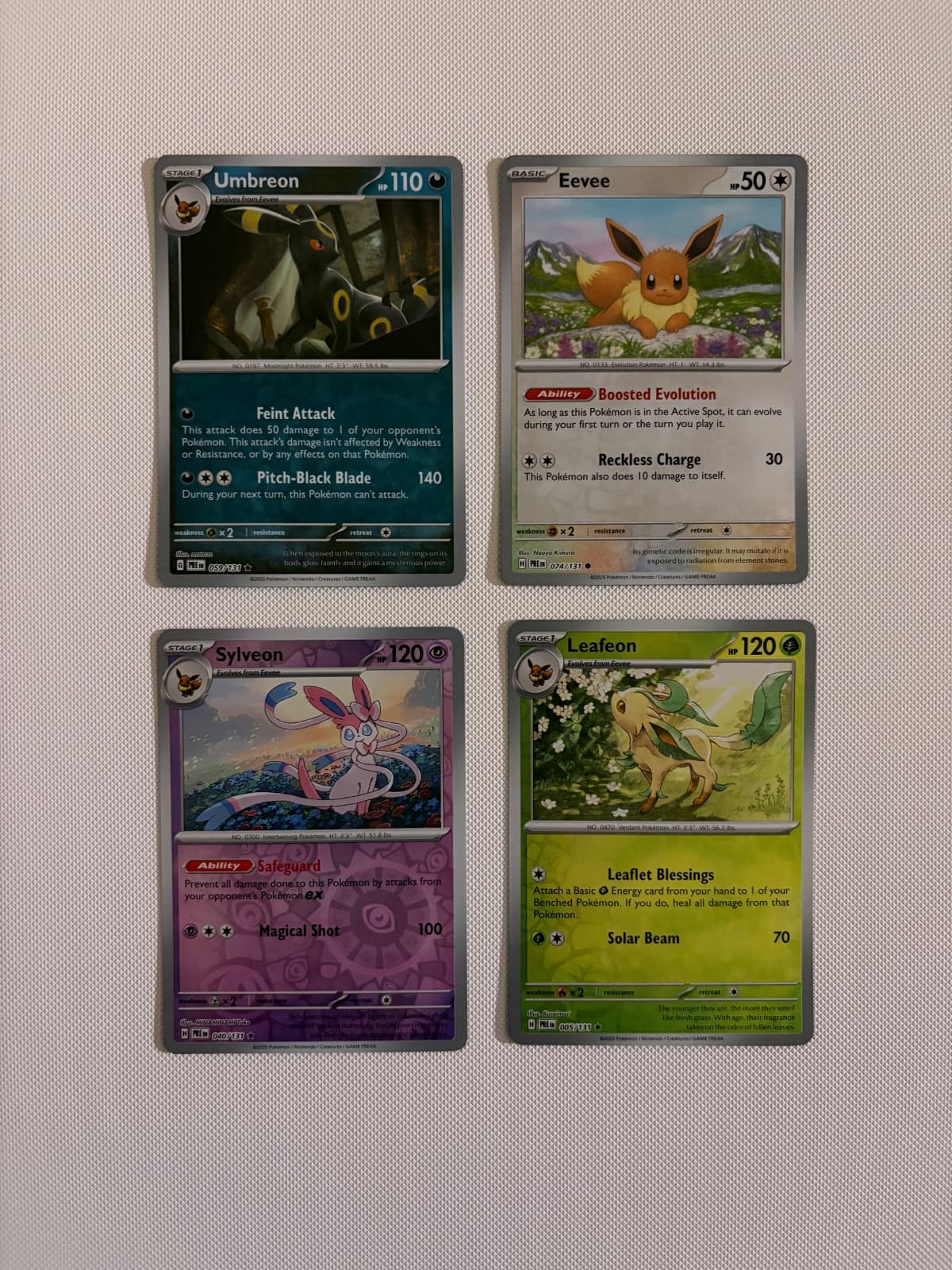 Umbreon 059/131, Eevee 074/131, Sylveon...