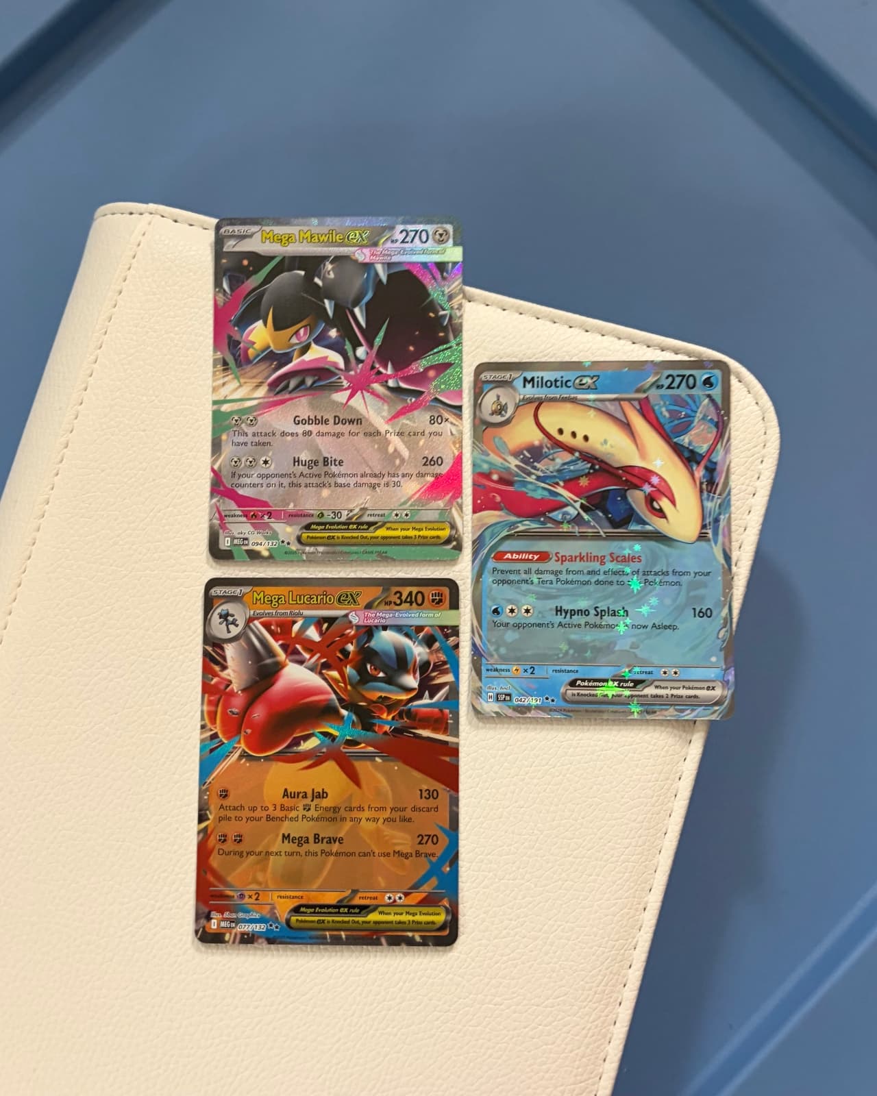 2 Mega Evolution exs + 1 Surging Sparks ex